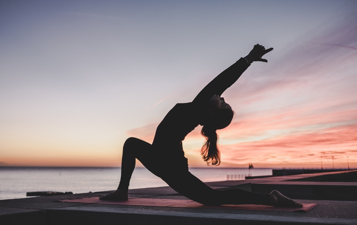 Woman practising yoga outdoors in Australia